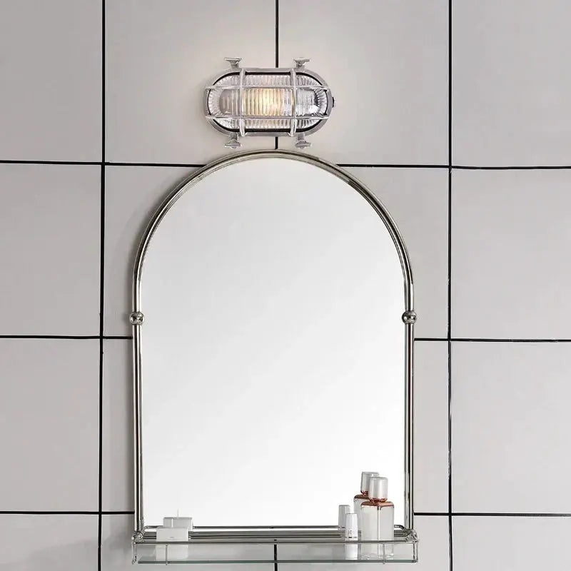 DecorBites Industrial Outdoor LED Wall Lamp with silver metal finish above a round arched mirror on Tampa Home & Garden Store