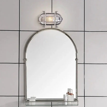 DecorBites Industrial Outdoor LED Wall Lamp with silver metal finish above a round arched mirror on Tampa Home & Garden Store