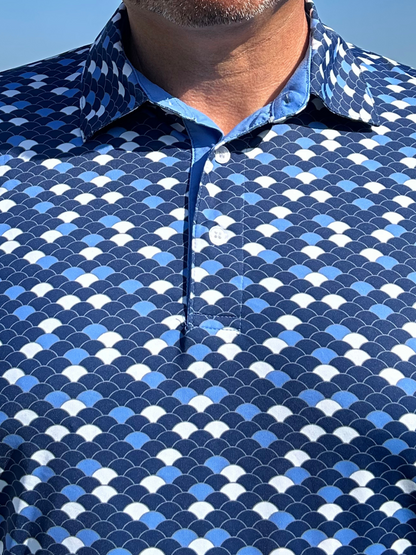 Scales Polo shirt in blue scale-pattern print with White Water Life branding on Tampa Home & Garden Store