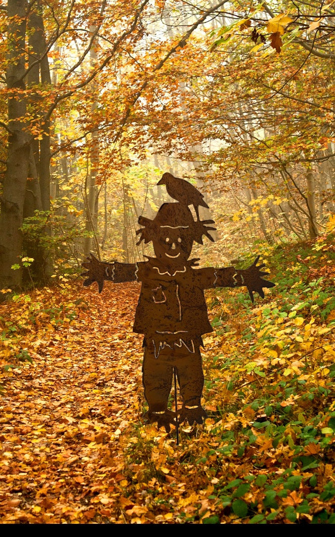 Outdoor scarecrow metal silhouette by Rustica Ornamentals with crow on hat in autumn forest on Tampa Home & Garden Store