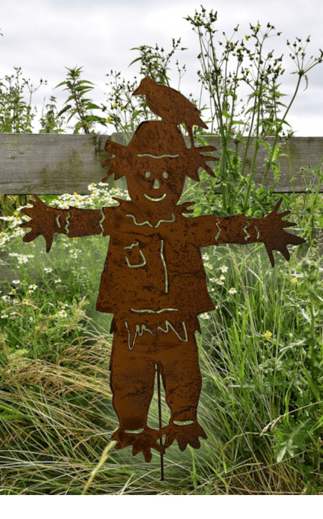rust-colored metal outdoor scarecrow garden stake with outstretched arms on Tampa Home & Garden Store