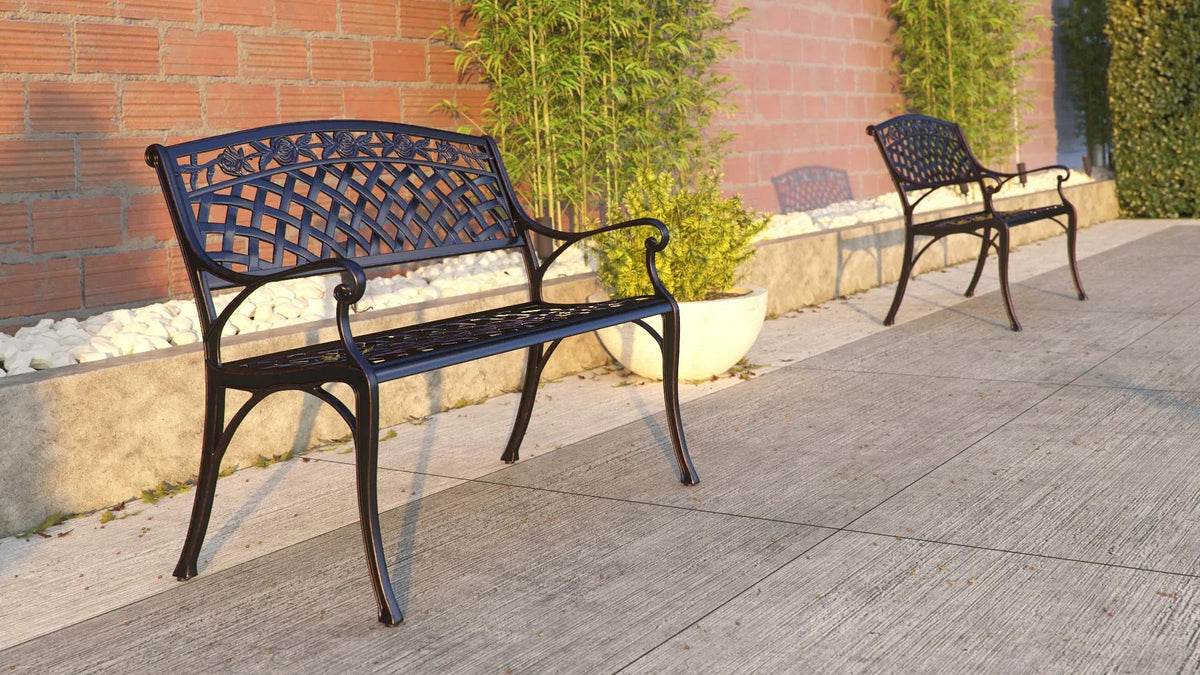 Scarlet Aluminum Patio Bench with lattice-back and curved arms; pair on brick walkway on Tampa Home & Garden Store