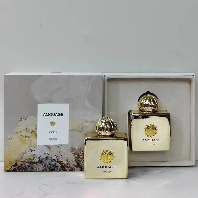 AMOUAGE GOLD perfume set; two gold square bottles with ornate caps in a presentation box on Tampa Home & Garden Store