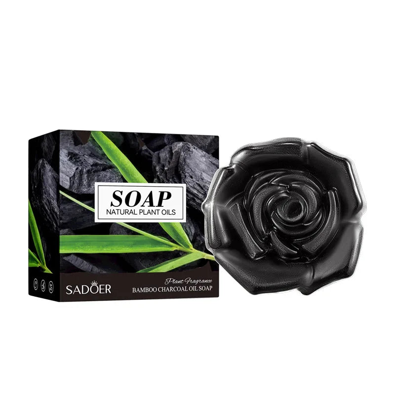 Bamboo charcoal soap rose beside a black SOAP Natural Plant Oils box with bamboo leaves on Tampa Home & Garden Store