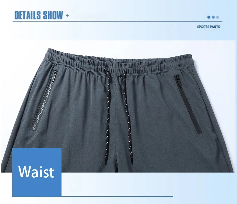 Gray men's jogger pants with elastic waistband, drawstring, and zippered side pockets on Tampa Home & Garden Store