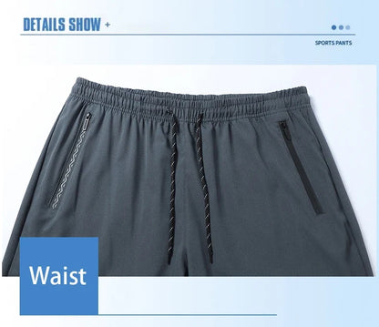 Gray men's jogger pants with elastic waistband, drawstring, and zippered side pockets on Tampa Home & Garden Store