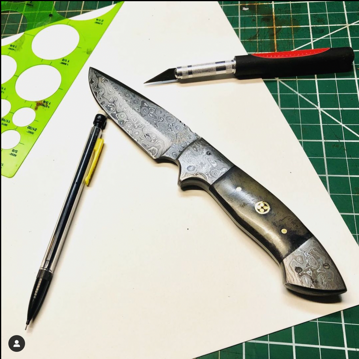 TD-005 Titan International K Damascus fixed-blade knife with dark wood handle on white desk on Tampa Home & Garden Store