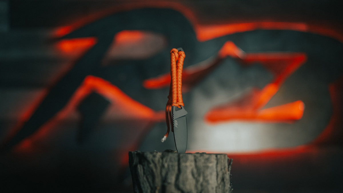 Ultralight Ridge Blade knife by Ridge Belts with orange paracord lanyard and gray blade on Tampa Home & Garden Store