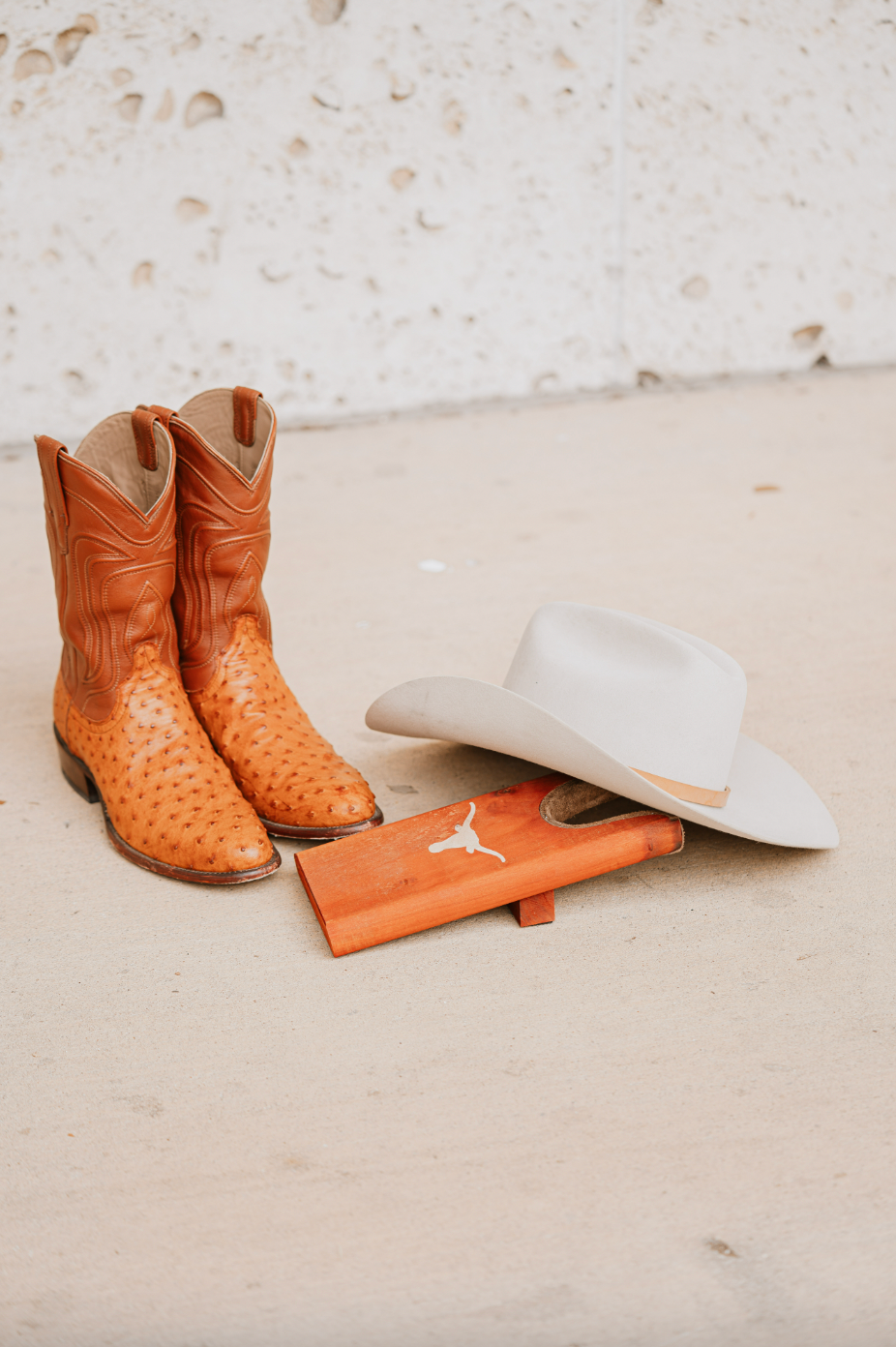 Texas Longhorn boot jack; boots and white hat nearby on Tampa Home & Garden Store