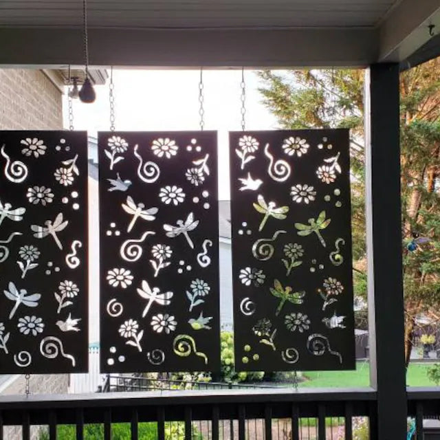 Outdoor metal privacy panels: three black steel screens with dragonfly cutouts, chains on Tampa Home & Garden Store