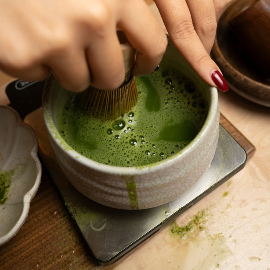 Premium Yabukita single cultivar matcha powder whisked into frothy green tea in a ceramic bowl on Tampa Home & Garden Store