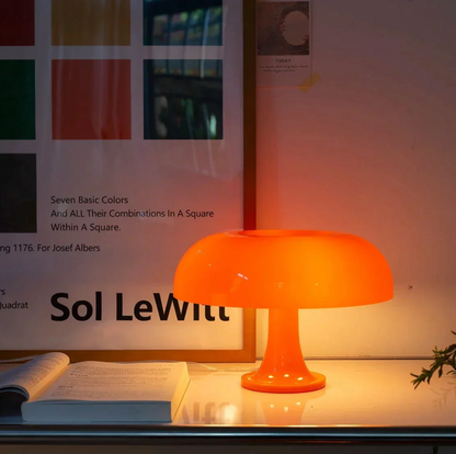 Nordic Mushroom Table Lamp Moktan Sabai, orange glass ambient night light on a desk beside book on Tampa Home & Garden Store
