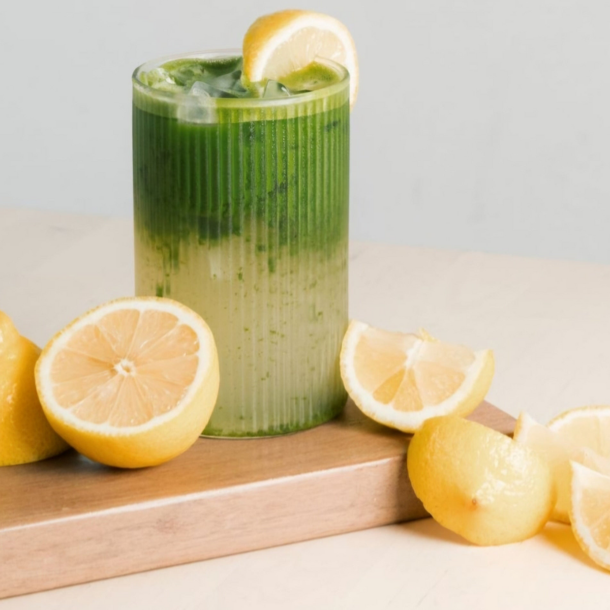 Yabukita single cultivar matcha drink by isshiki matcha in a tall green glass with lemon garnish on Tampa Home & Garden Store
