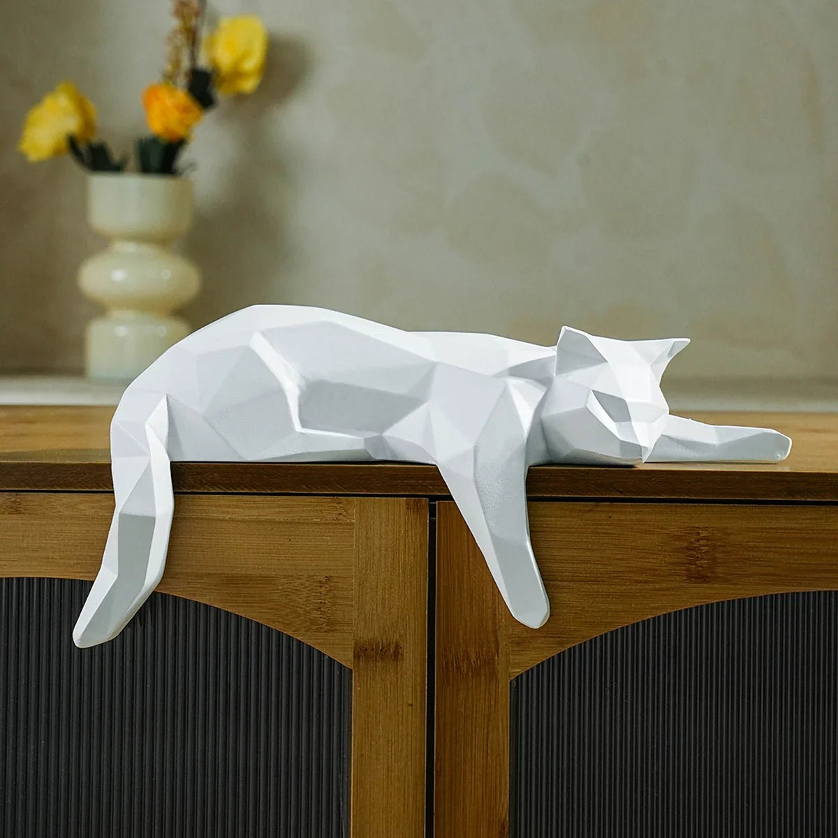 White geometric cat statue lying on a wooden cabinet, modern desk decor sculpture on Tampa Home & Garden Store