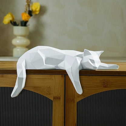 White geometric cat statue lying on a wooden cabinet, modern desk decor sculpture on Tampa Home & Garden Store