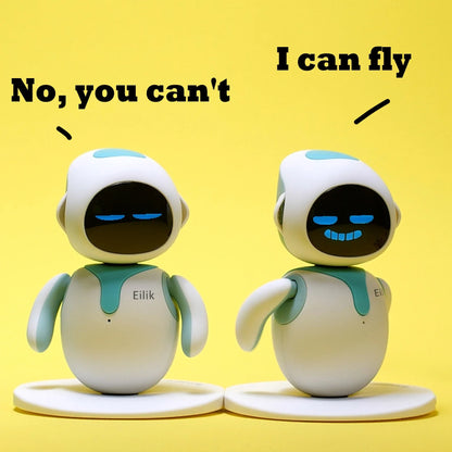 Eilik desk companion robots in white with teal accents and blue display faces on round bases on Tampa Home & Garden Store