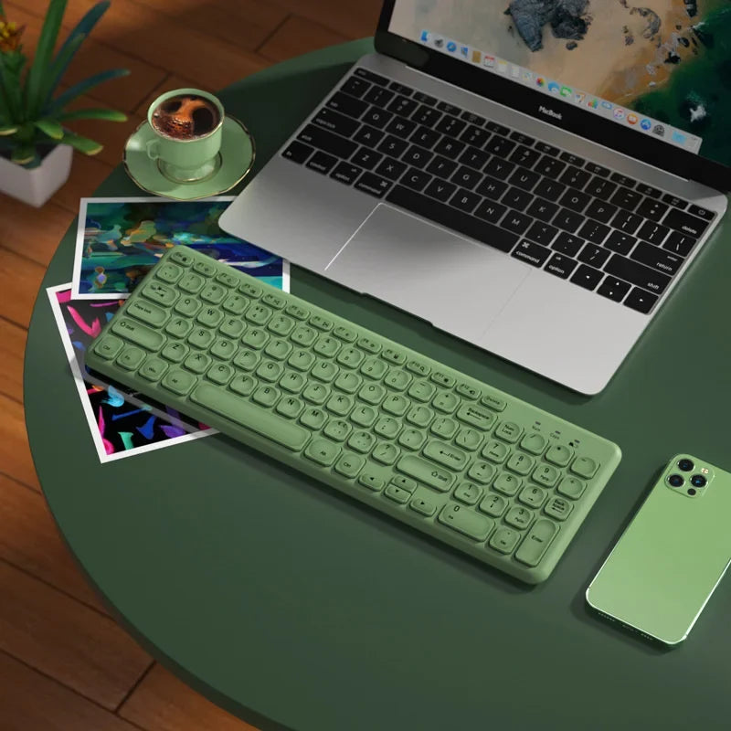 FLIPSTYLEZLLC mint-green wireless keyboard on a green table beside a MacBook and mint smartphone on Tampa Home & Garden Store