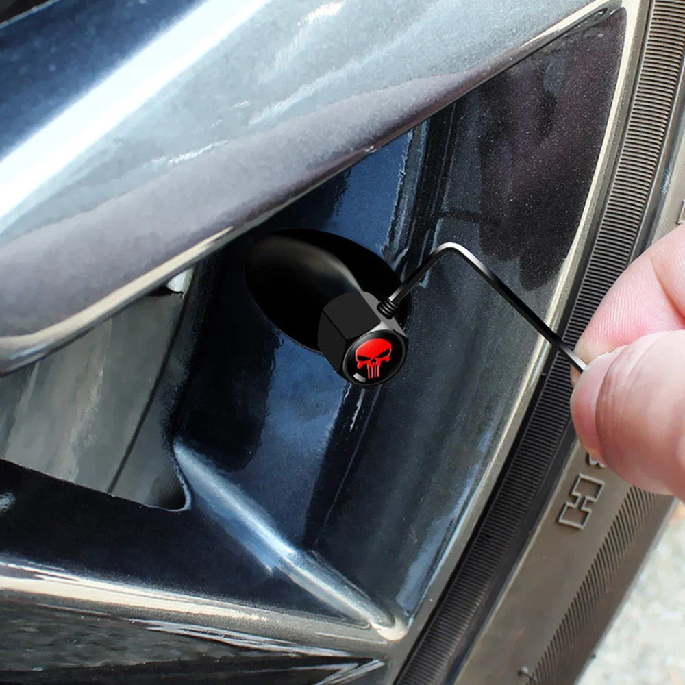 Anti-Theft Skull Valve Stem Caps in black with red skull logo on car tire valve by BikerZoneZ on Tampa Home & Garden Store
