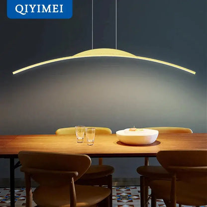 DecorBites LED Pendant Lamp minimalist curved hanging light above wooden dining table with two glasses on Tampa Home & Garden Store