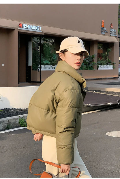 Women Winter Cropped Cotton-Padded Puffer Jacket in olive with high collar worn by model on Tampa Home & Garden Store
