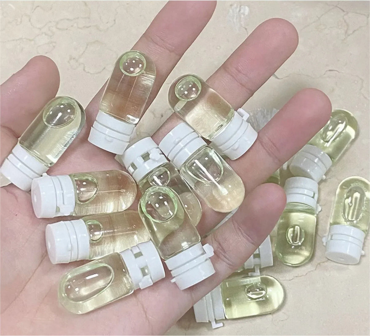 Cleansing oil ampoules in pale yellow capsules with white caps travel-size camellia oil makeup remover on Tampa Home & Garden Store