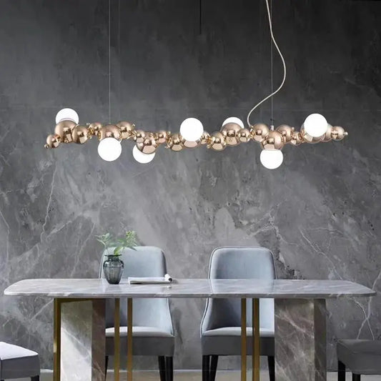 DecorBites LED pendant chandelier with gold-tone bead spheres and white globes on Tampa Home & Garden Store