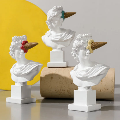Apollo resin busts by Perfecsy with ice cream cone hats, three white statues on pedestals on Tampa Home & Garden Store