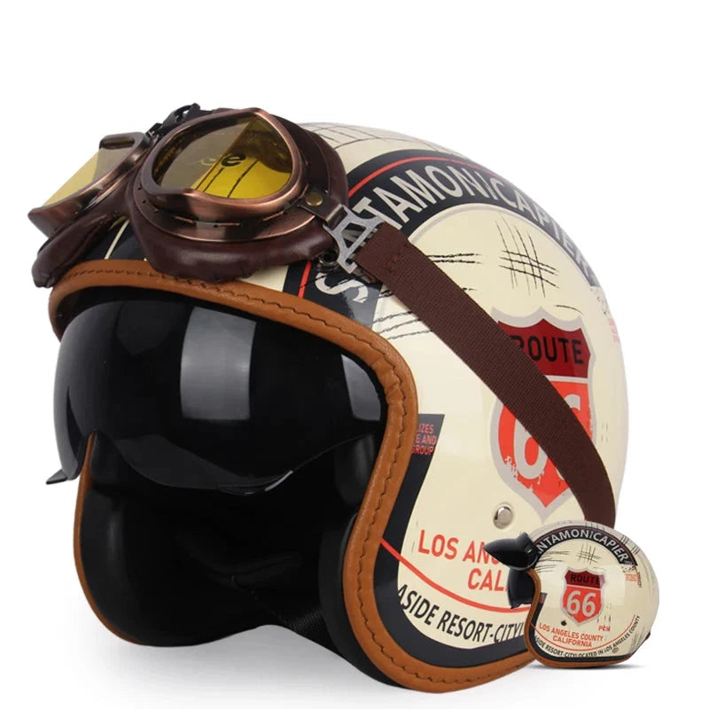 Vintage open-face cream helmet with Route 66 decals, brown leather trim and yellow goggles on Tampa Home & Garden Store