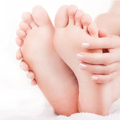 Pair of feet exfoliating foot masks with pedicure socks, pale feet and pink nails on Tampa Home & Garden Store