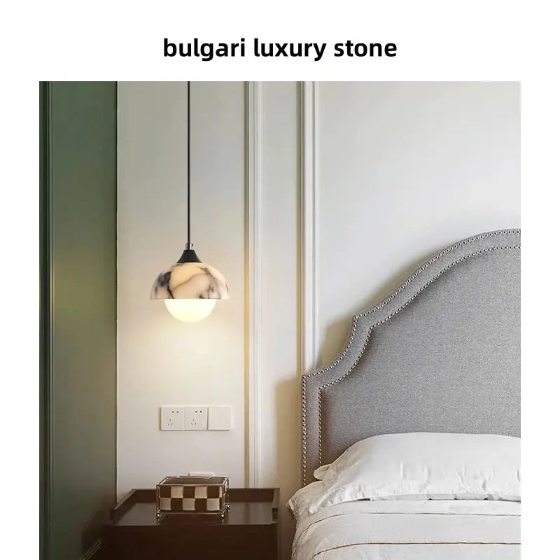 DecorBites LED pendant lamp adjustable wire globe with marble shade beside bed tufted headboard on Tampa Home & Garden Store