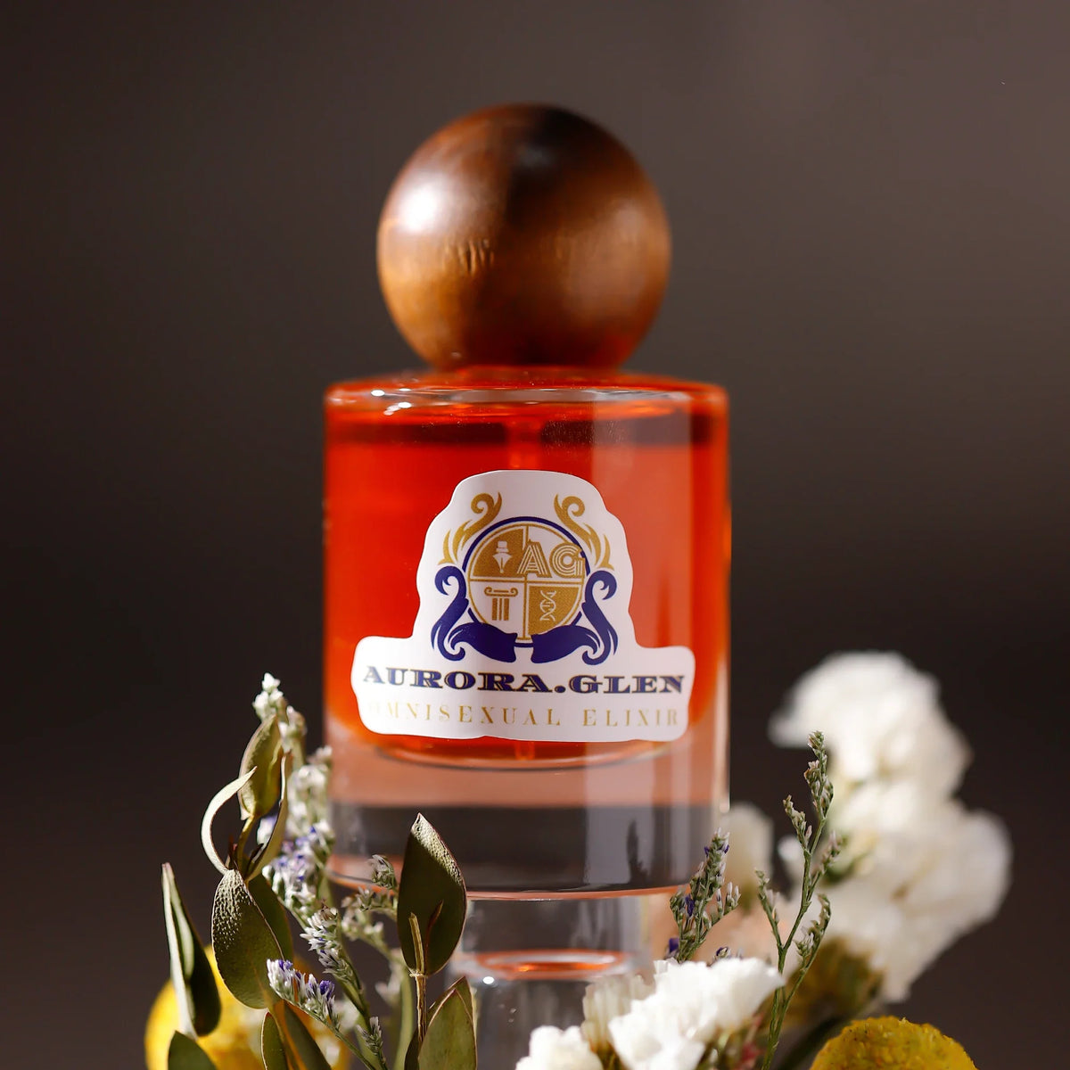 Arabian Oud perfume bottle by Silcy Skin, orange glass with a round wooden cap and regal crest label on Tampa Home & Garden Store