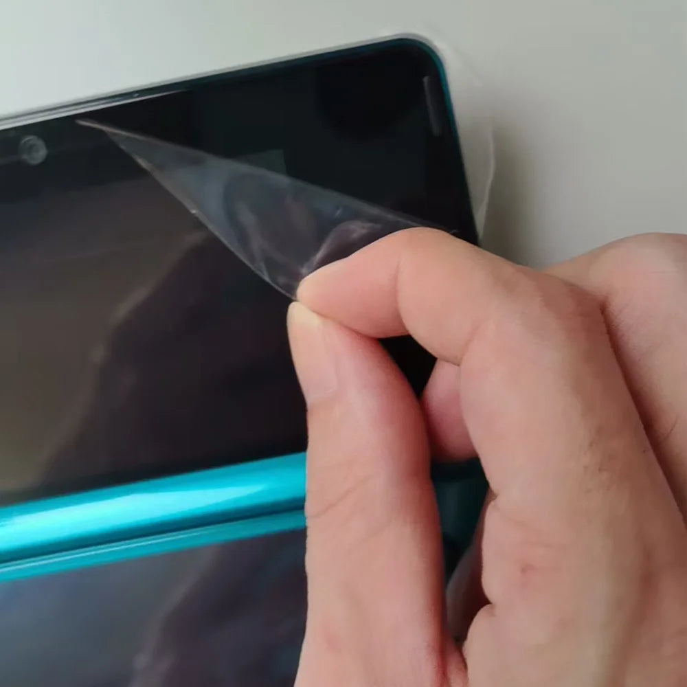 Refurbished 3DS handheld console in turquoise with protective screen film being peeled on Tampa Home & Garden Store