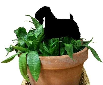 Sealyham Terrier plant stake silhouette in black atop a green snake plant in a terracotta pot on Tampa Home & Garden Store