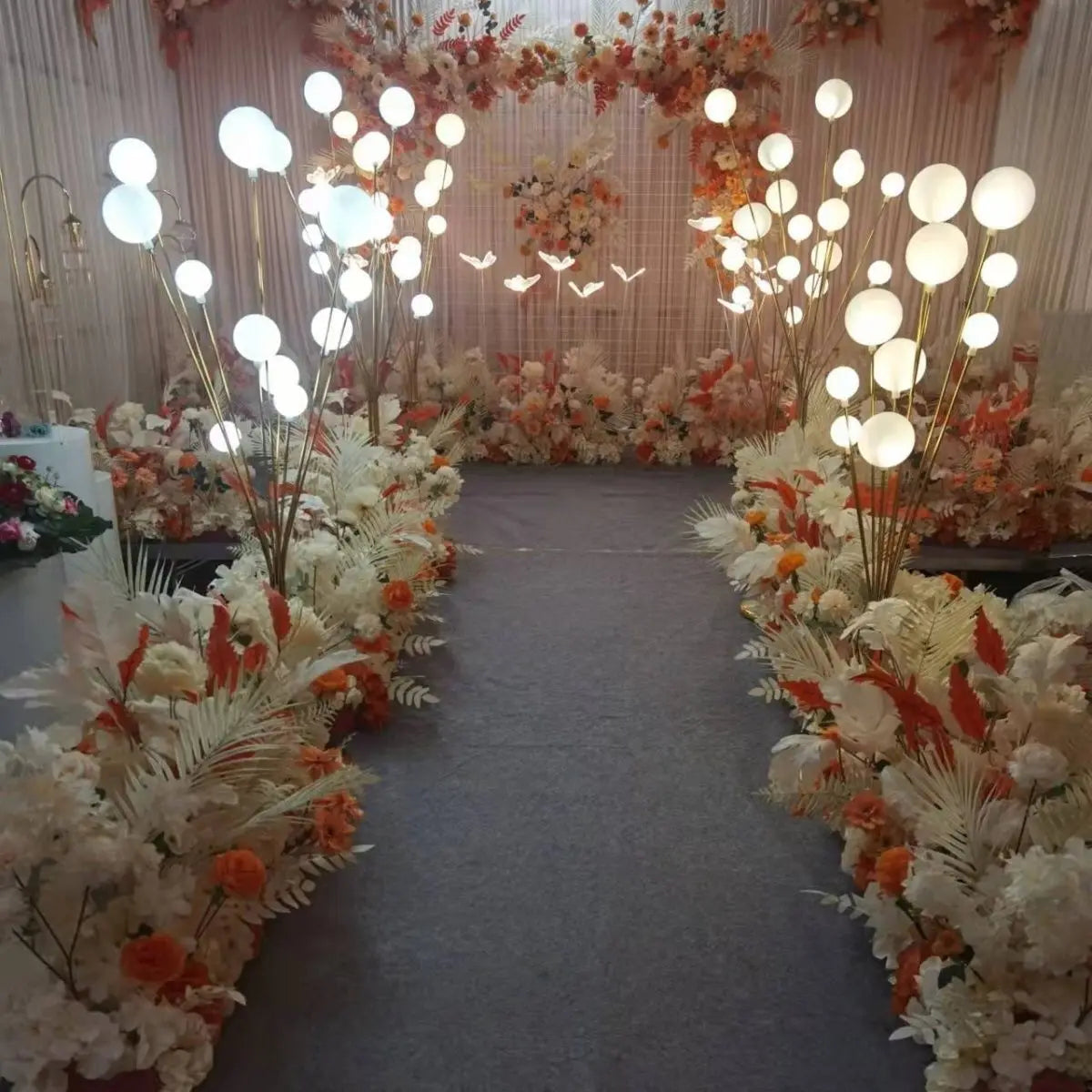 DecorBites LED Apple Tree decor ball lights pair flanking a floral wedding aisle on Tampa Home & Garden Store
