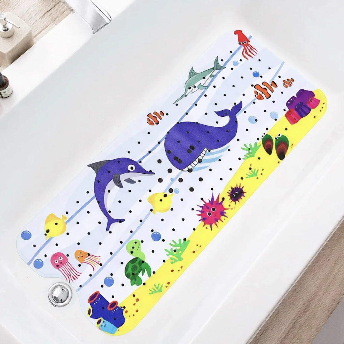 Cartoon sea life bathtub mat with suction cups and drain holes, white and yellow border on Tampa Home & Garden Store
