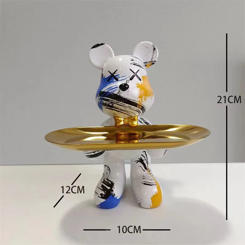 Graffiti bear ornament holding a gold tray, white with blue and yellow brush strokes on Tampa Home & Garden Store
