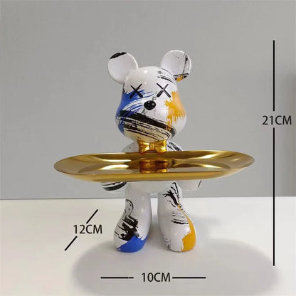 Graffiti bear ornament holding a gold tray, white with blue and yellow brush strokes on Tampa Home & Garden Store