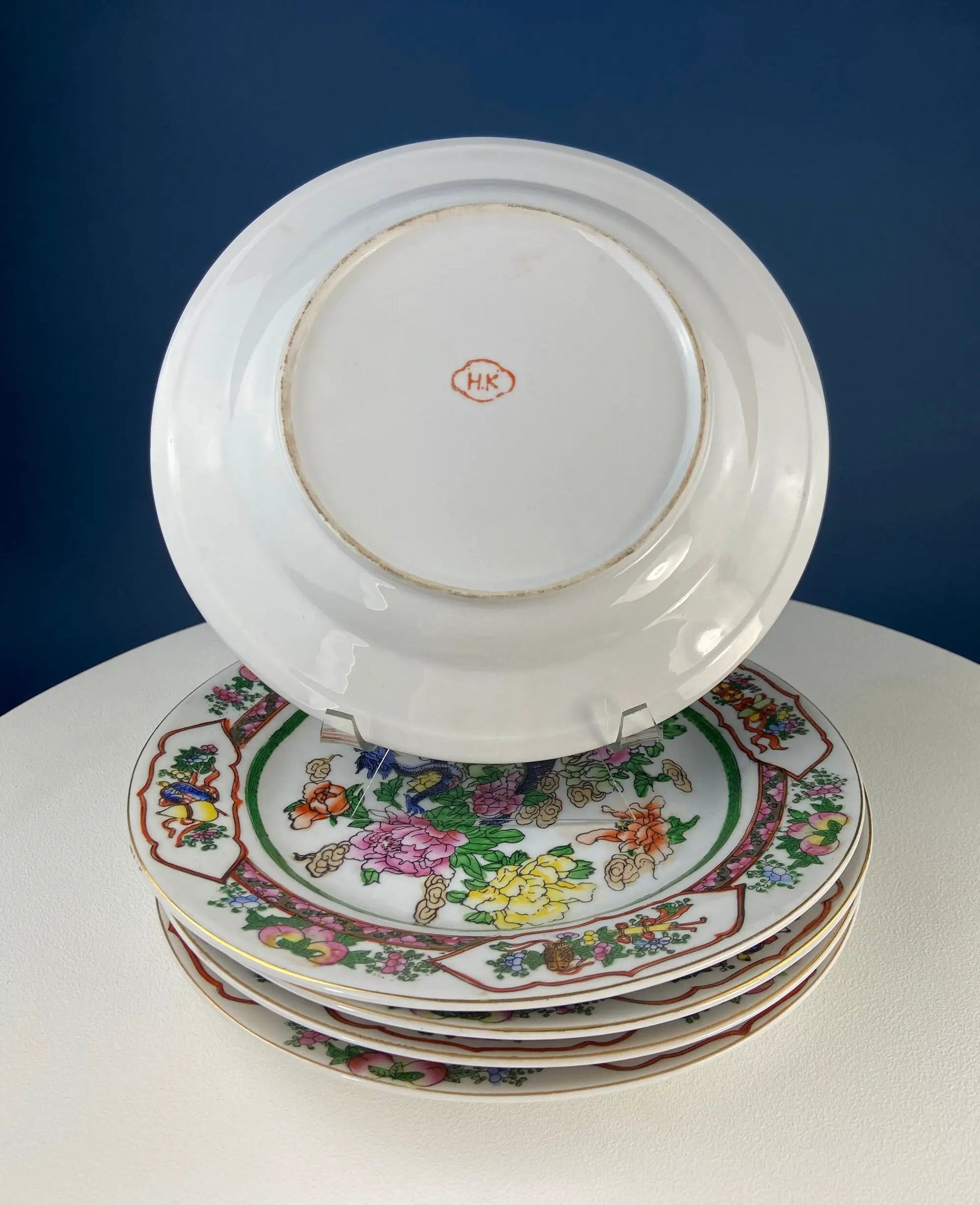Five large Asian porcelain plates with dragons and peonies; HK mark on base on Tampa Home & Garden Store