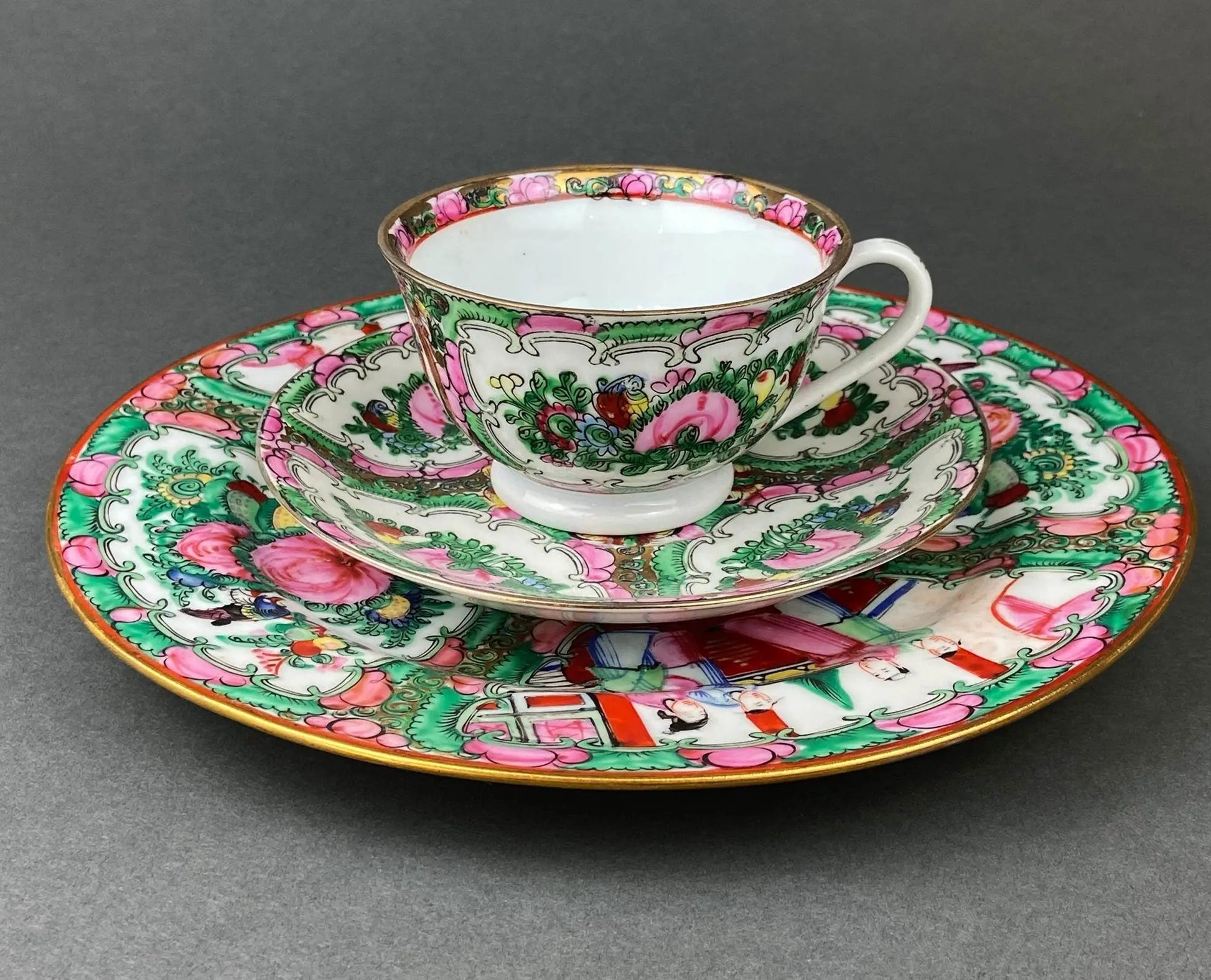 Five large Asian plates with dragons and peonies, colorful floral motifs with gold rims on Tampa Home & Garden Store