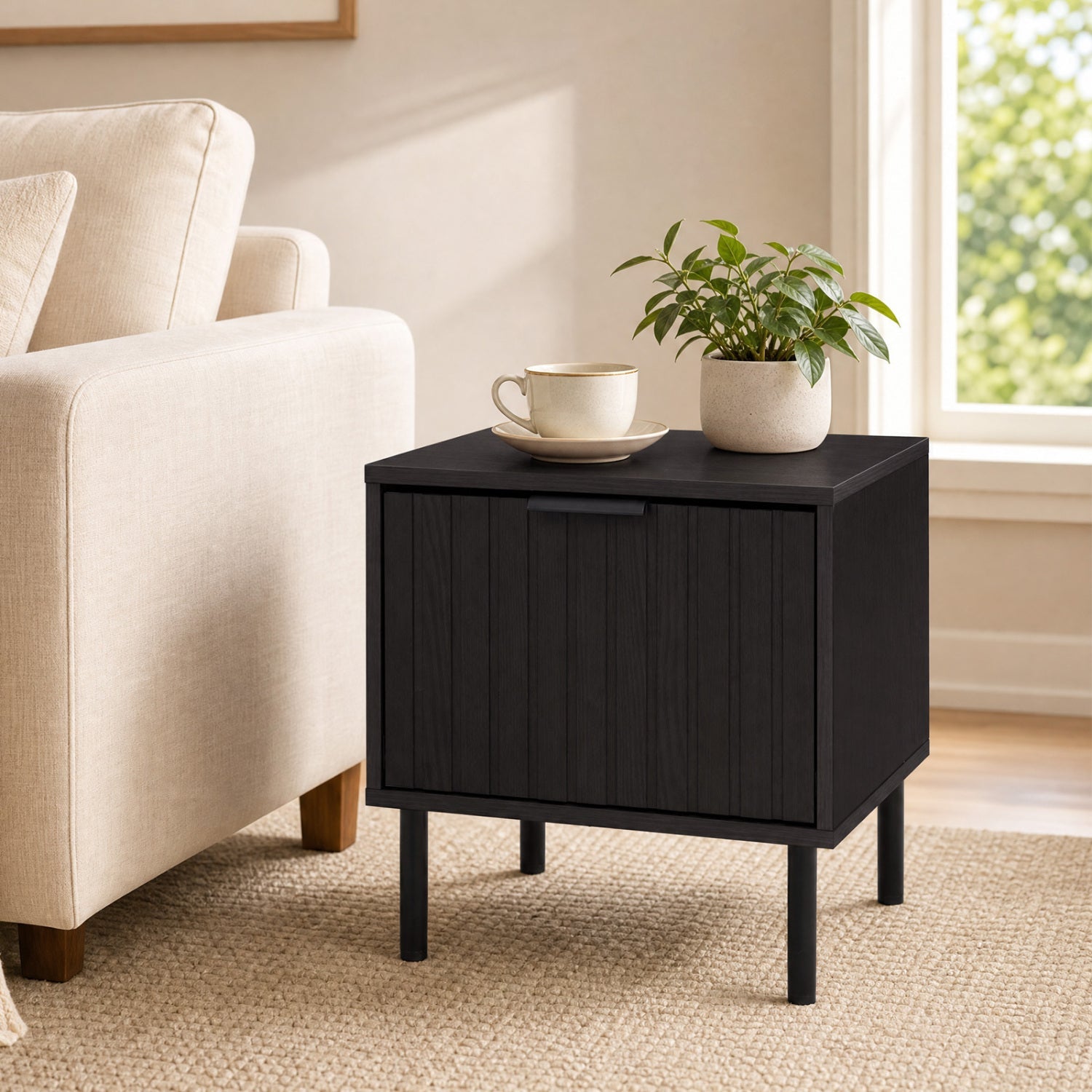 Modern black nightstand with vertical striped drawer, plant and teacup on top on Tampa Home & Garden Store