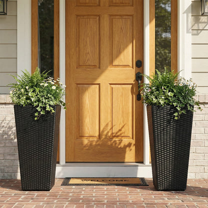 Set of 2 black rattan tall plant pots with detachable liners, greenery and daisies by the door on Tampa Home & Garden Store
