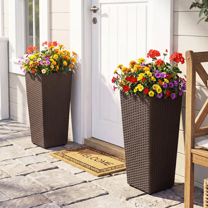 Tall rattan planter set of 2 with liners, brown wicker, flowers by a white door on Tampa Home & Garden Store