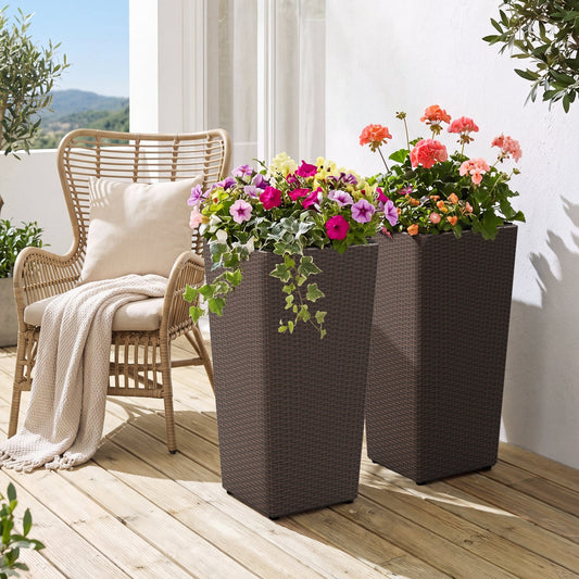 Tall rattan planters set of 2 with liners, brown wicker pots filled with colorful flowers on a wooden deck on Tampa Home & Garden Store