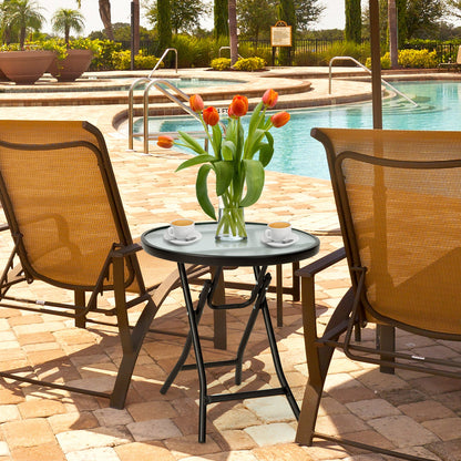 DirectDeals round folding patio side table with tempered glass top and black frame, poolside on Tampa Home & Garden Store