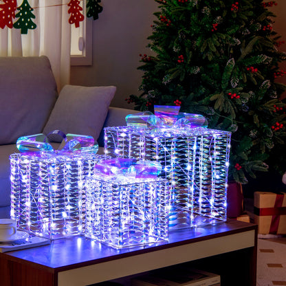 Set of 3 iridescent Christmas gift boxes by DirectDeals with bows, LED-lit on a coffee table on Tampa Home & Garden Store