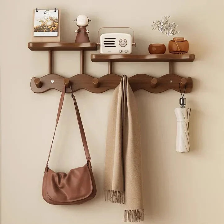 Moktan Sabai Bamboo Wall Coat Rack with two shelves; beige scarf and brown bag hung on Tampa Home & Garden Store
