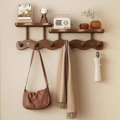 Moktan Sabai Bamboo Wall Coat Rack with two shelves; beige scarf and brown bag hung on Tampa Home & Garden Store