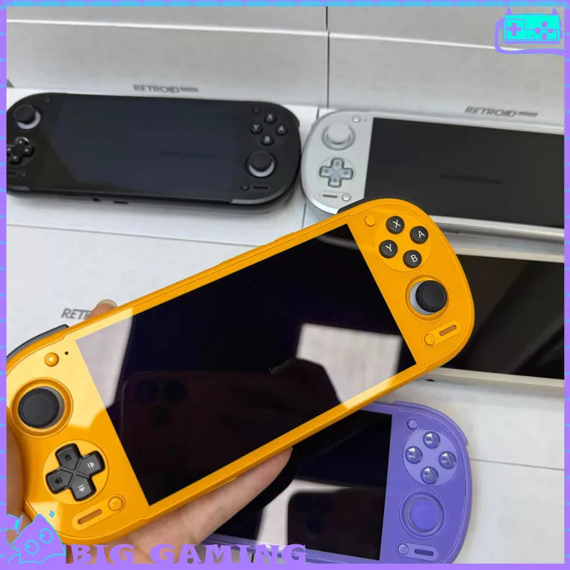 Retroid Pocket 6 handheld consoles in yellow-purple with black and white units on display on Tampa Home & Garden Store