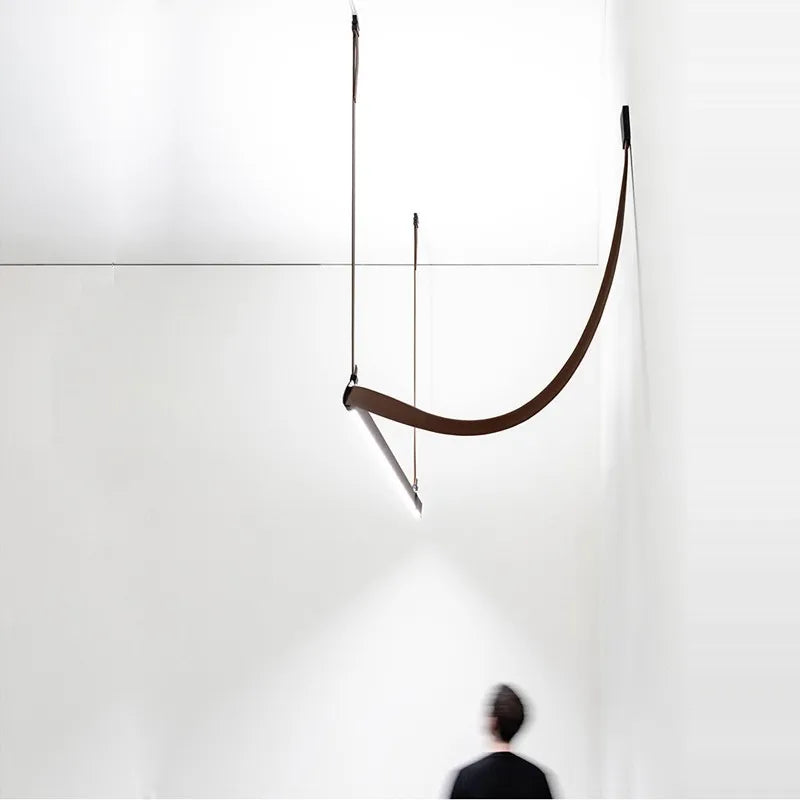 DecorBites LED Art Deco chandelier curved brown arc pendant over white wall for dining room on Tampa Home & Garden Store