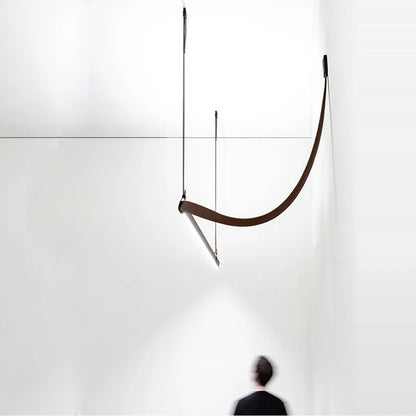 DecorBites LED Art Deco chandelier curved brown arc pendant over white wall for dining room on Tampa Home & Garden Store